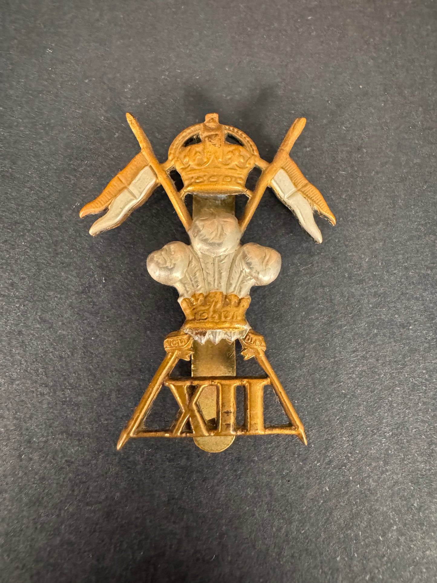 Photo 1 of WW1 British Army 12th Lancers Cavalry Cap Badge XII L - collectible militaria item