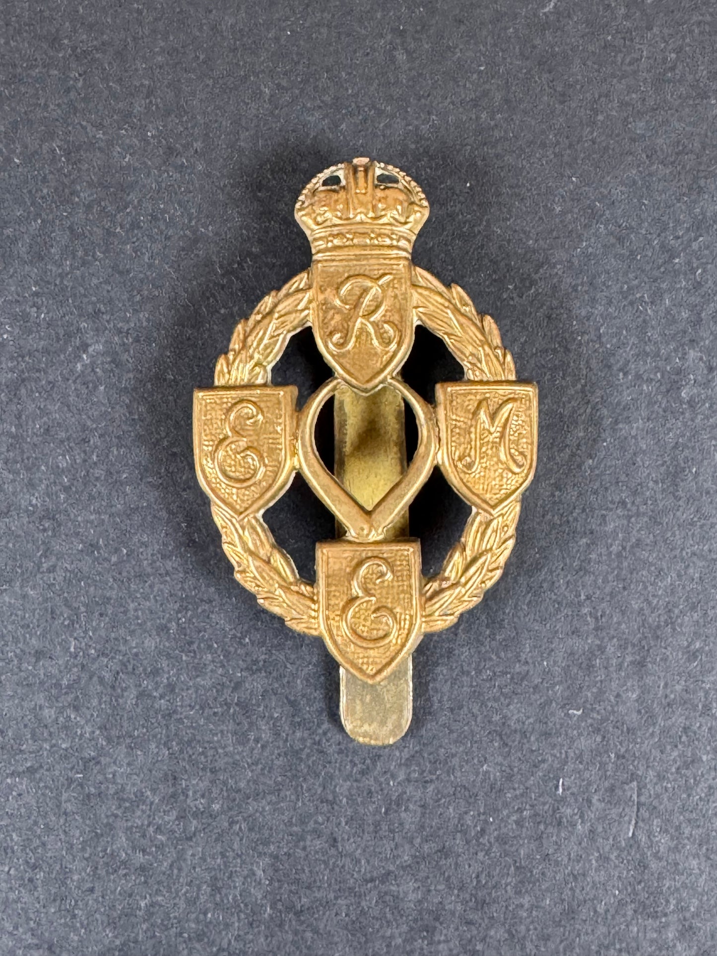 Photo 1 of WW2 British Army Royal Electrical & Mechanical Engineers Cap Badge - collectible militaria item