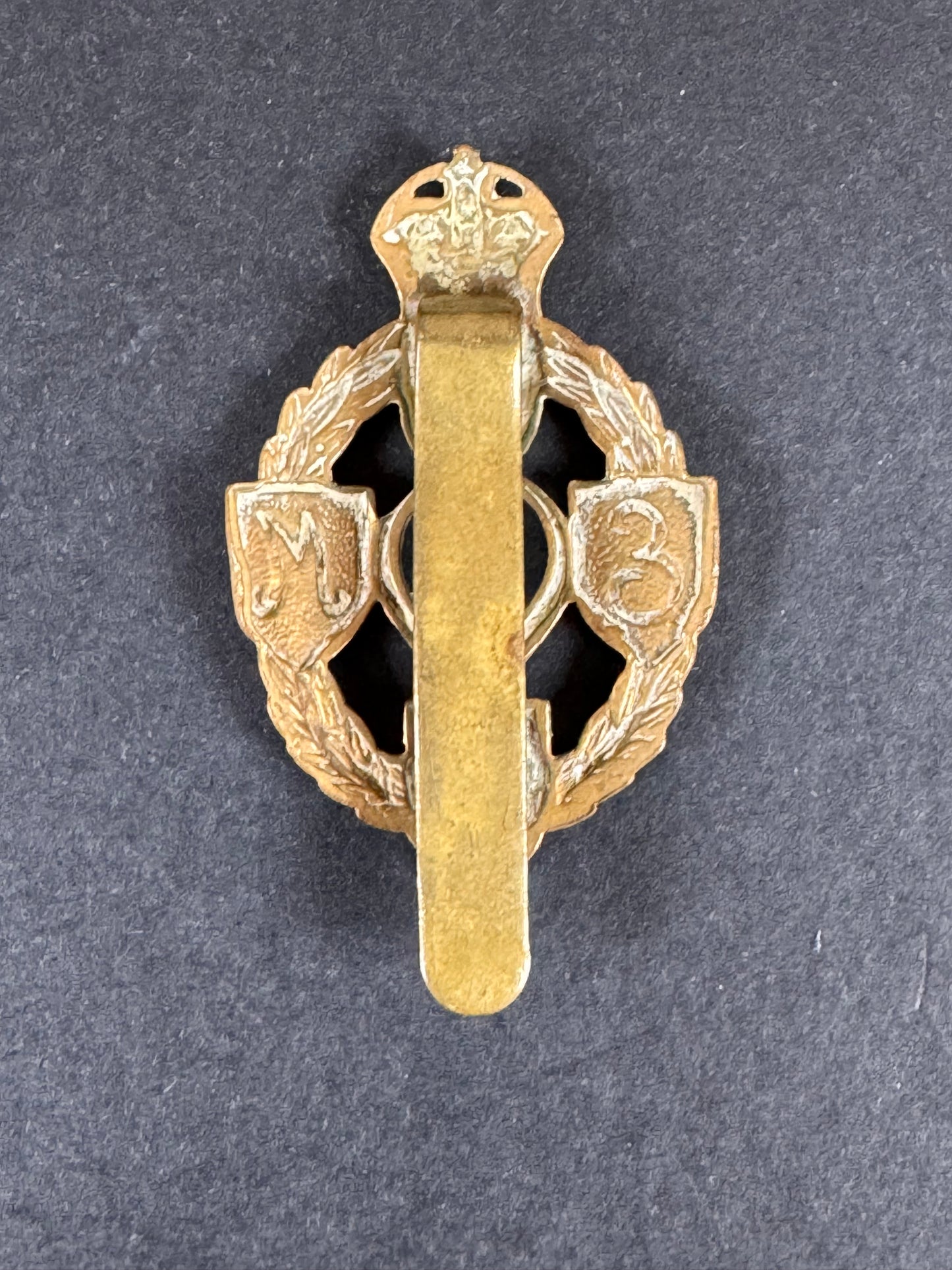 Photo 2 of WW2 British Army Royal Electrical & Mechanical Engineers Cap Badge - collectible militaria item