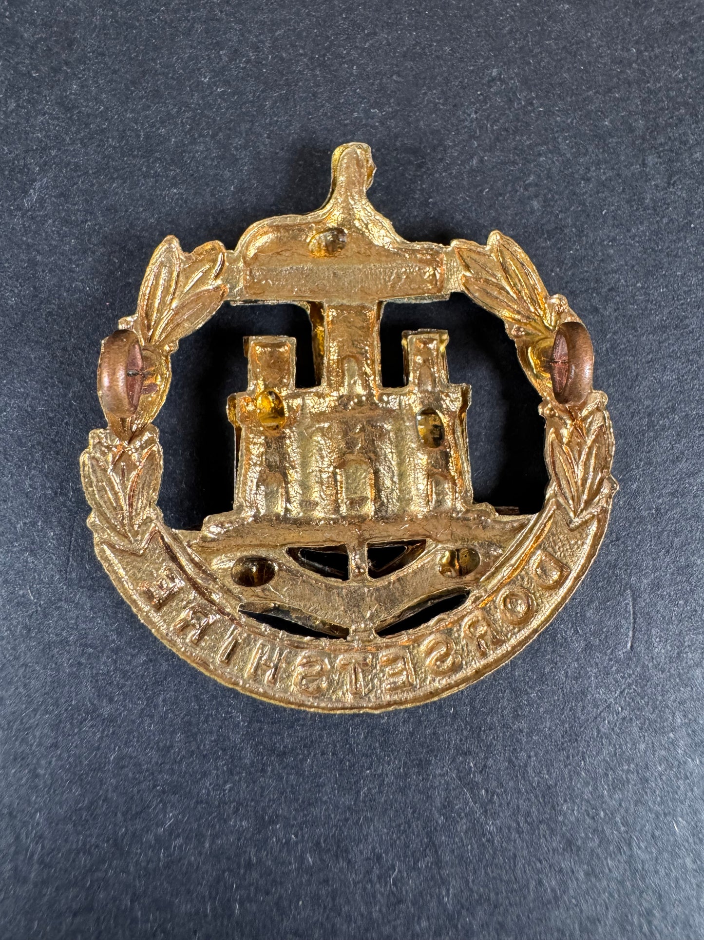 Photo 2 of WW1 British Army Dorsetshire Regiment Cap Badge - collectible militaria item