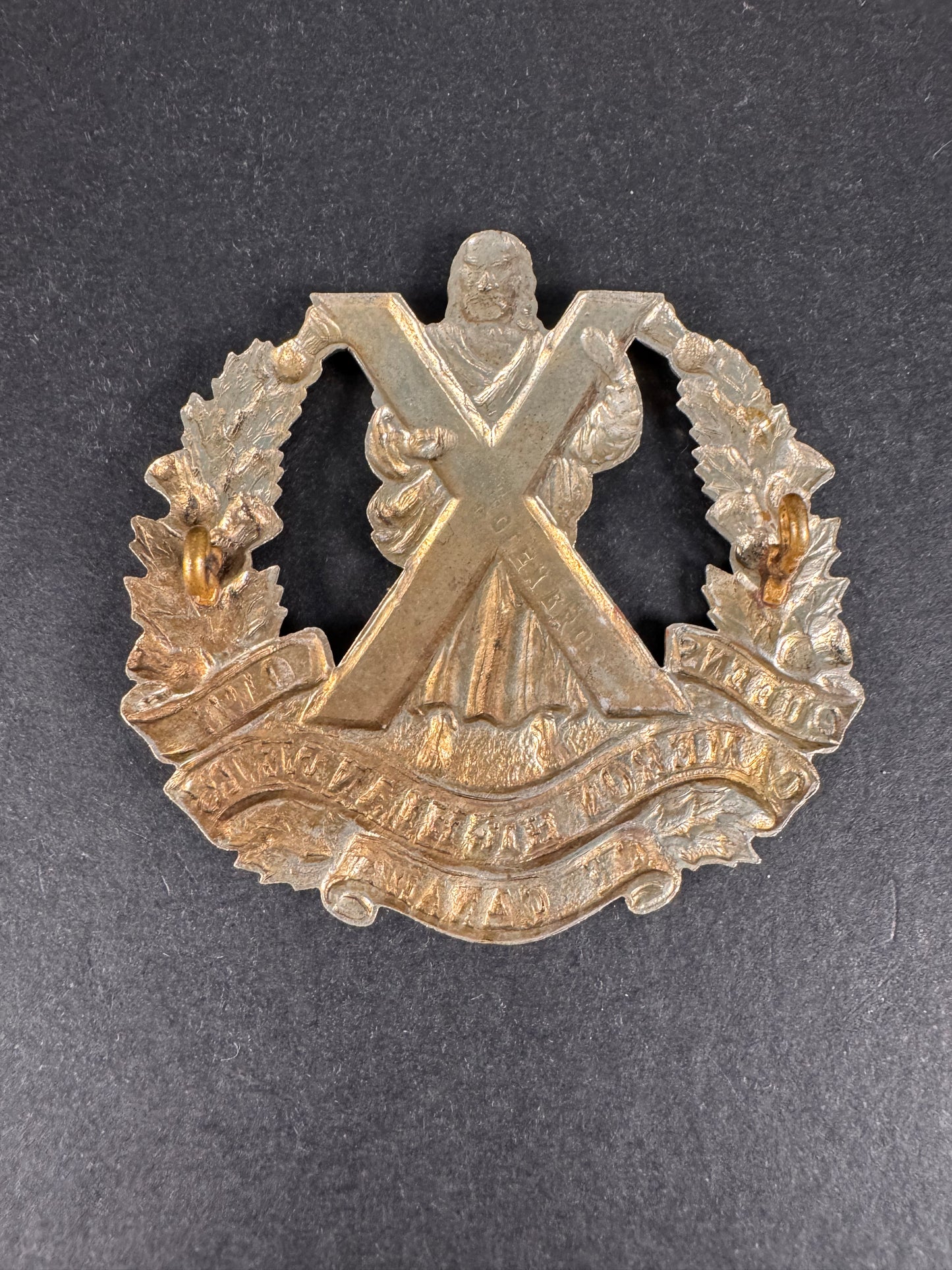 Photo 2 of WW2 Canadian Army Queen's Own Cameron Highlanders of Canada Cap Badge - collectible militaria item