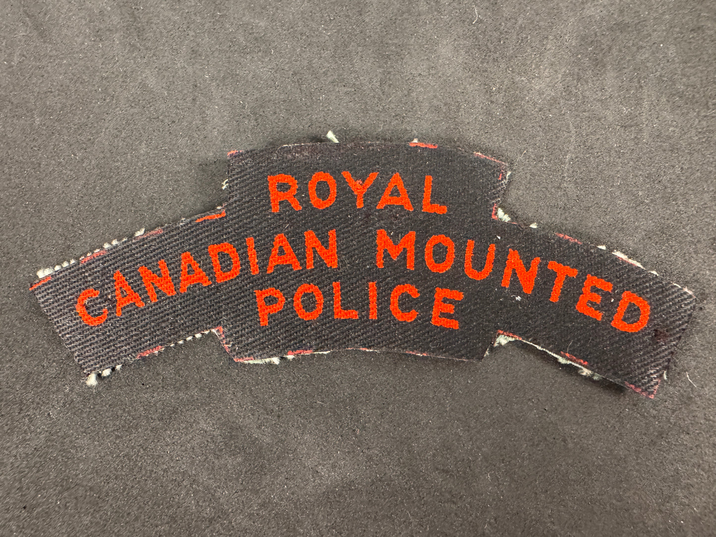 Photo 1 of WW2 Royal Canadian Mounted Police (RCMP) Screen Printed Shoulder Title - collectible militaria item