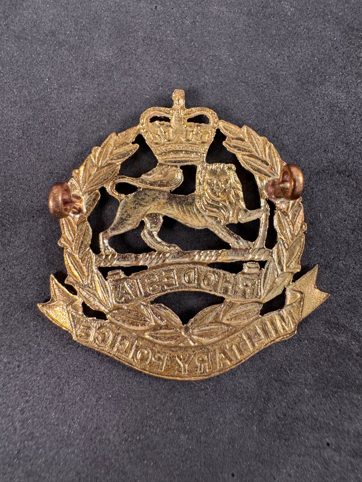 Photo 2 of Rhodesia Corps of Military Police Cap Badge 1965-1967 - collectible militaria item