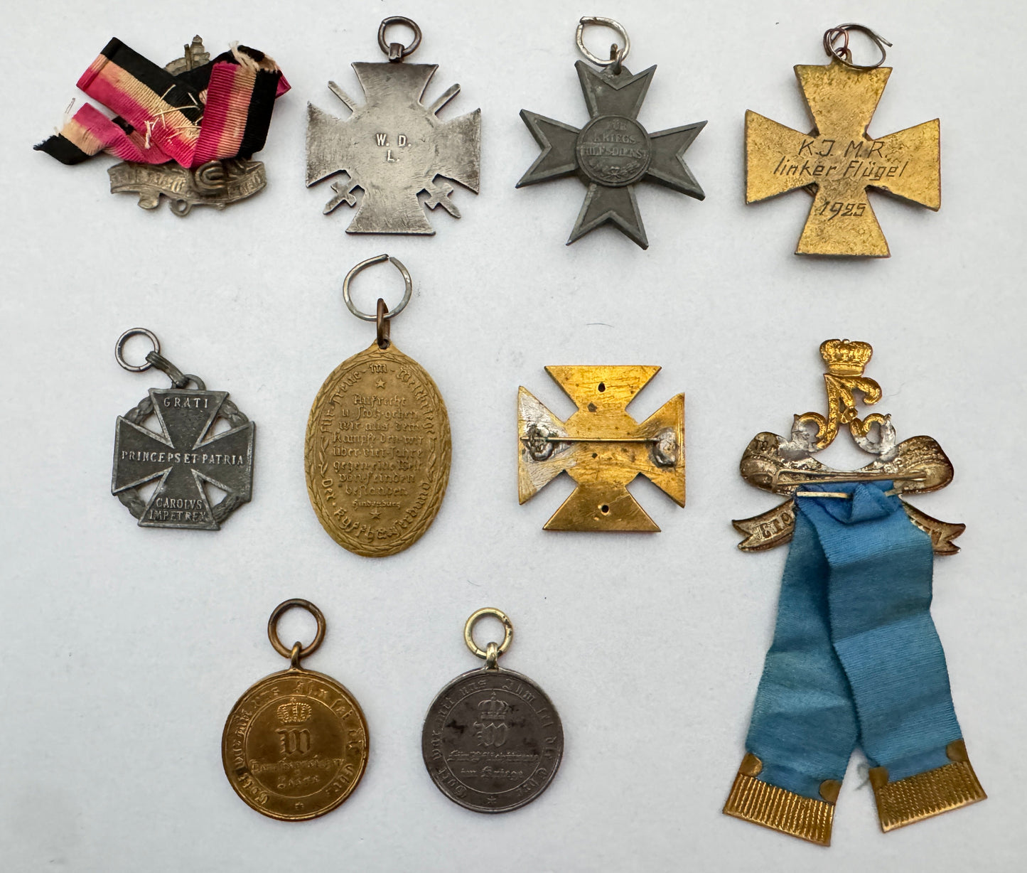 collection of imperial German medals, badges, and awards. rear view.