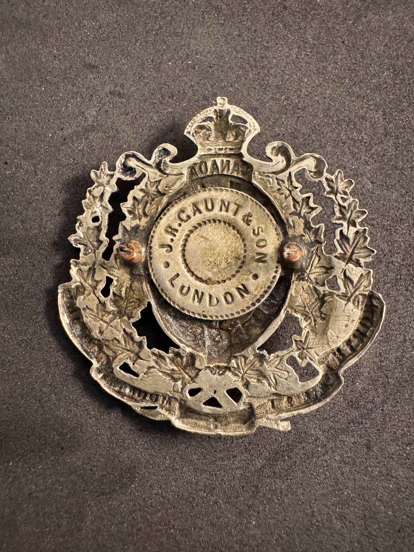 Photo 2 of Canadian North West Mounted Police Cap Badge - J.R. Gaunt London - collectible militaria item