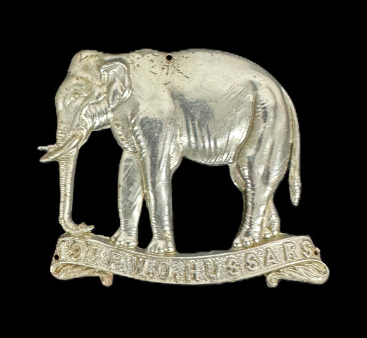 an original cap badge of the 19th hussars, part of an article by medals militaria, about how to spot fakes of this type