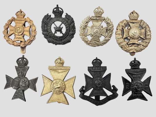 a gallery of fake cap badges of the county of london regiment.