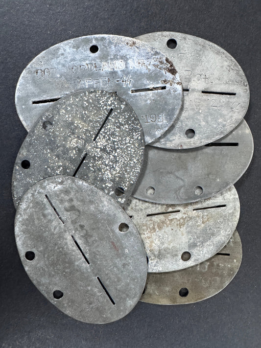 a lot of world war two german soldier's identity discs. part of the medals-militaria blog post on these items