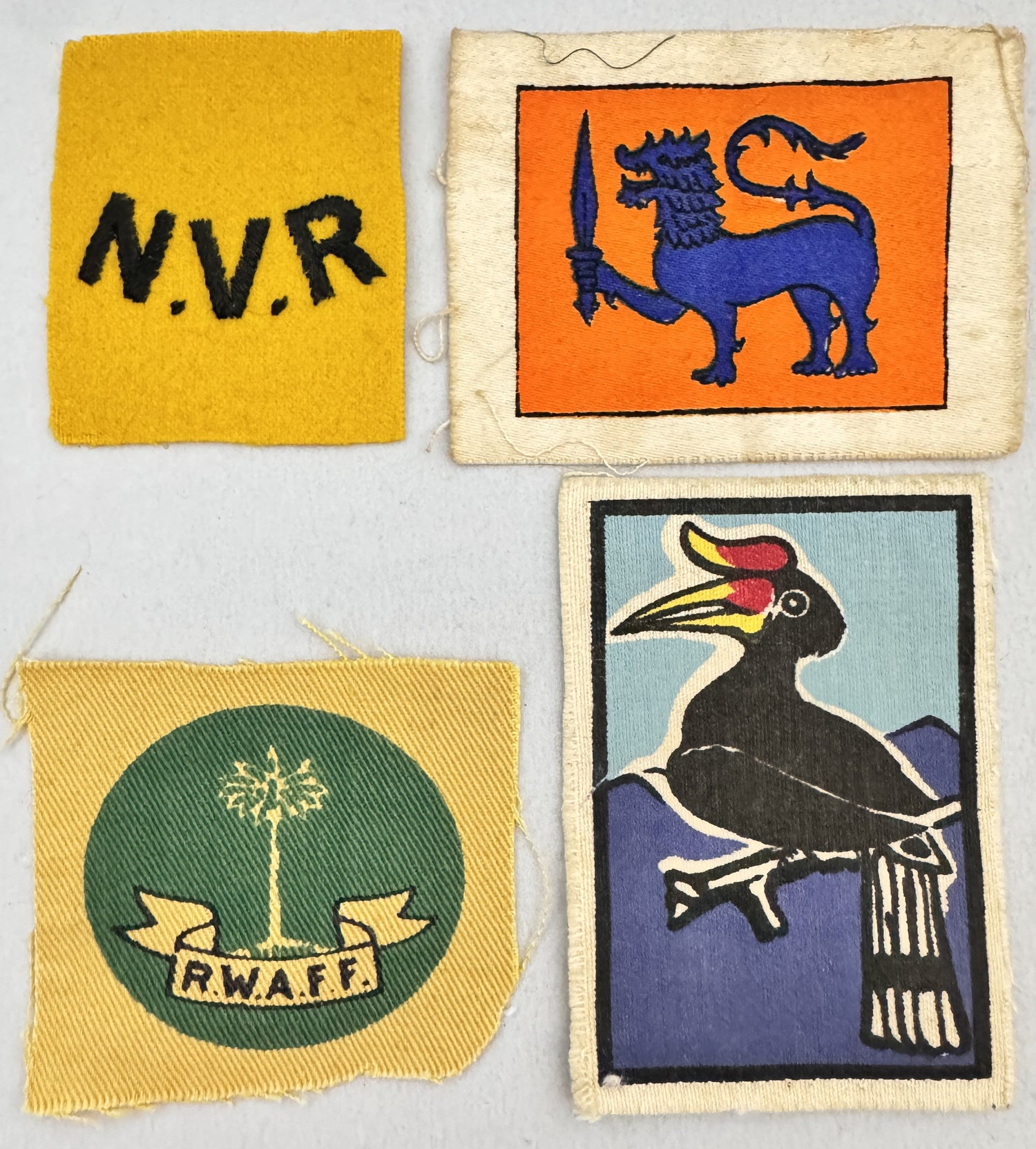 british colonial military insignia, formation signs, brightly coloured unique designs for unit recognition.