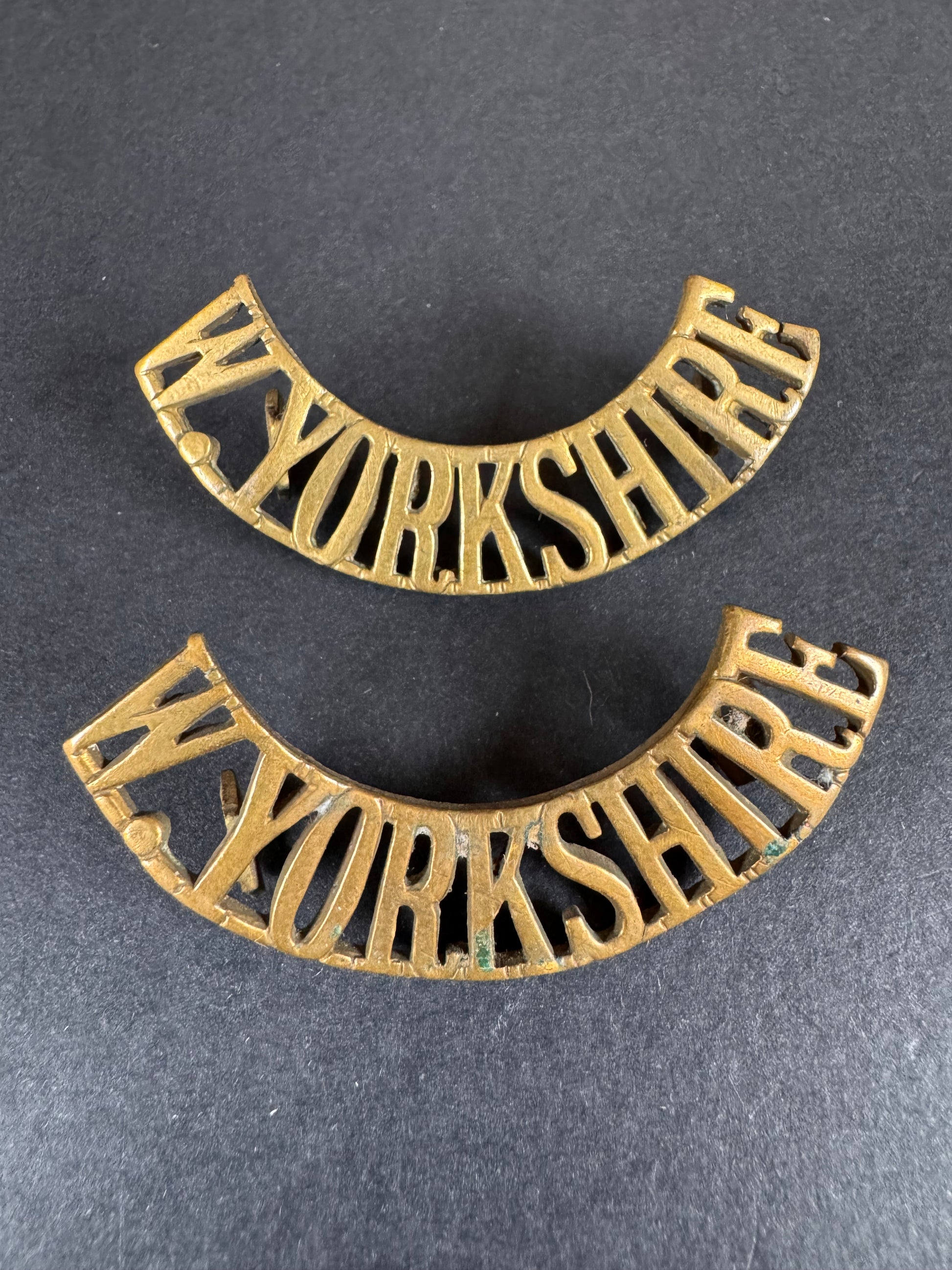 Photo 1 of WW1 British Army West Yorkshire Regiment Uniform Shoulder Title Badges - collectible militaria item