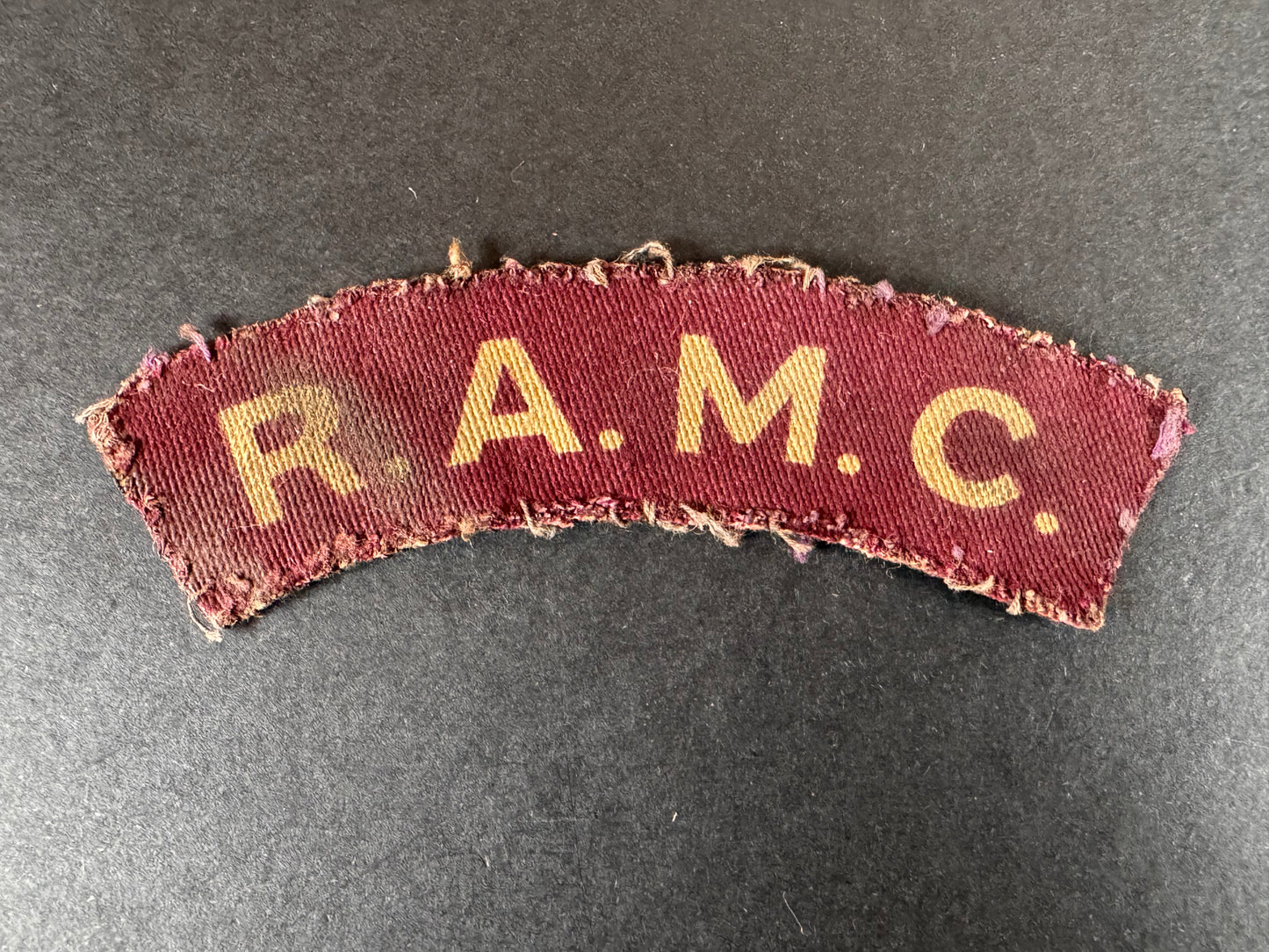 Photo 1 of WW2 British Royal Army Medical Corps Printed Shoulder Title Badge - collectible militaria item
