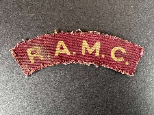 Photo 1 of WW2 British Royal Army Medical Corps Printed Shoulder Title Badge - collectible militaria item