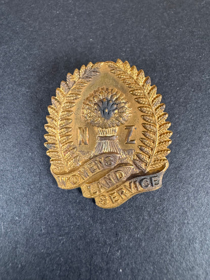 Photo 1 of WW2 New Zealand Women's Land Service Cap Badge - collectible militaria item