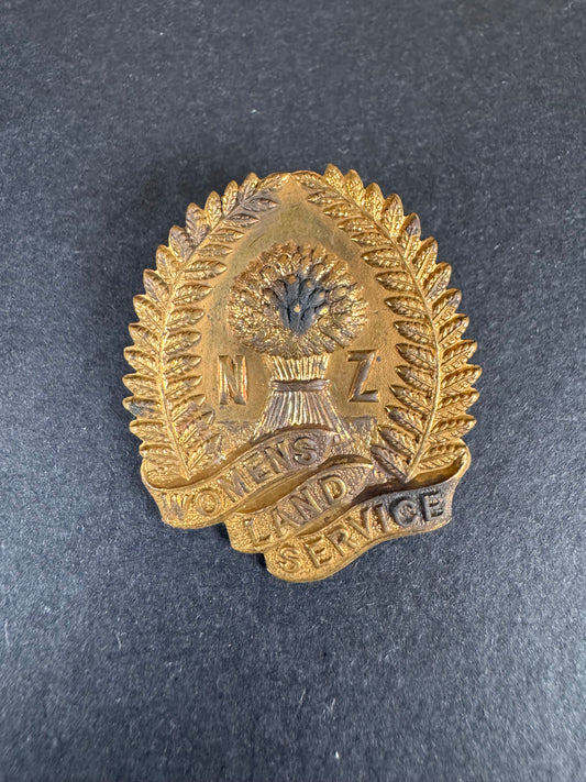 Photo 1 of WW2 New Zealand Women's Land Service Cap Badge - collectible militaria item