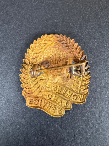 Photo 2 of WW2 New Zealand Women's Land Service Cap Badge - collectible militaria item