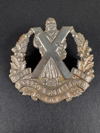 Photo 1 of WW2 Canadian Army Queen's Own Cameron Highlanders of Canada Cap Badge - collectible militaria item