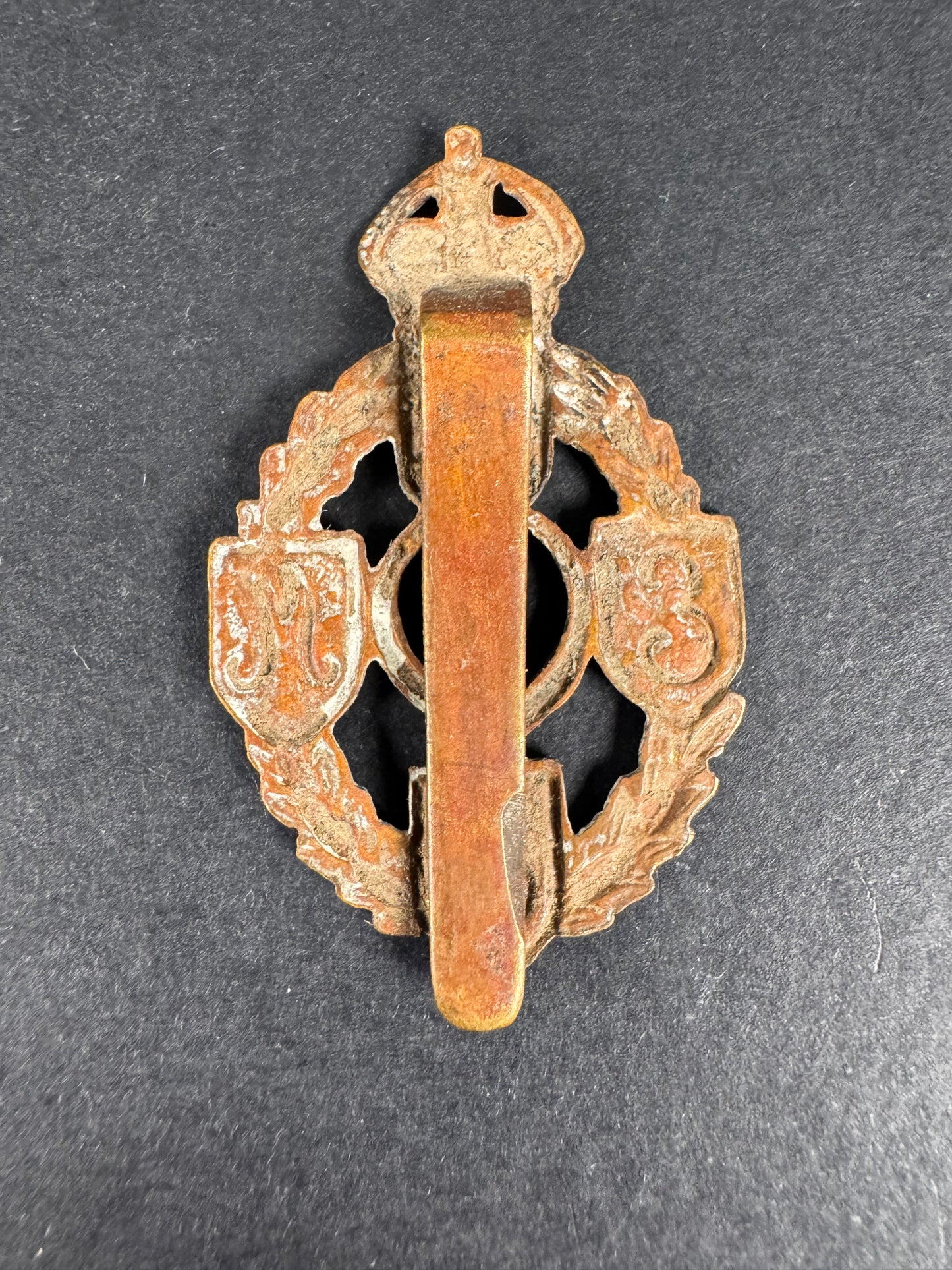 Photo 2 of WW2 British Army Royal Electrical & Mechanical Engineers Cap Badge REME - collectible militaria item