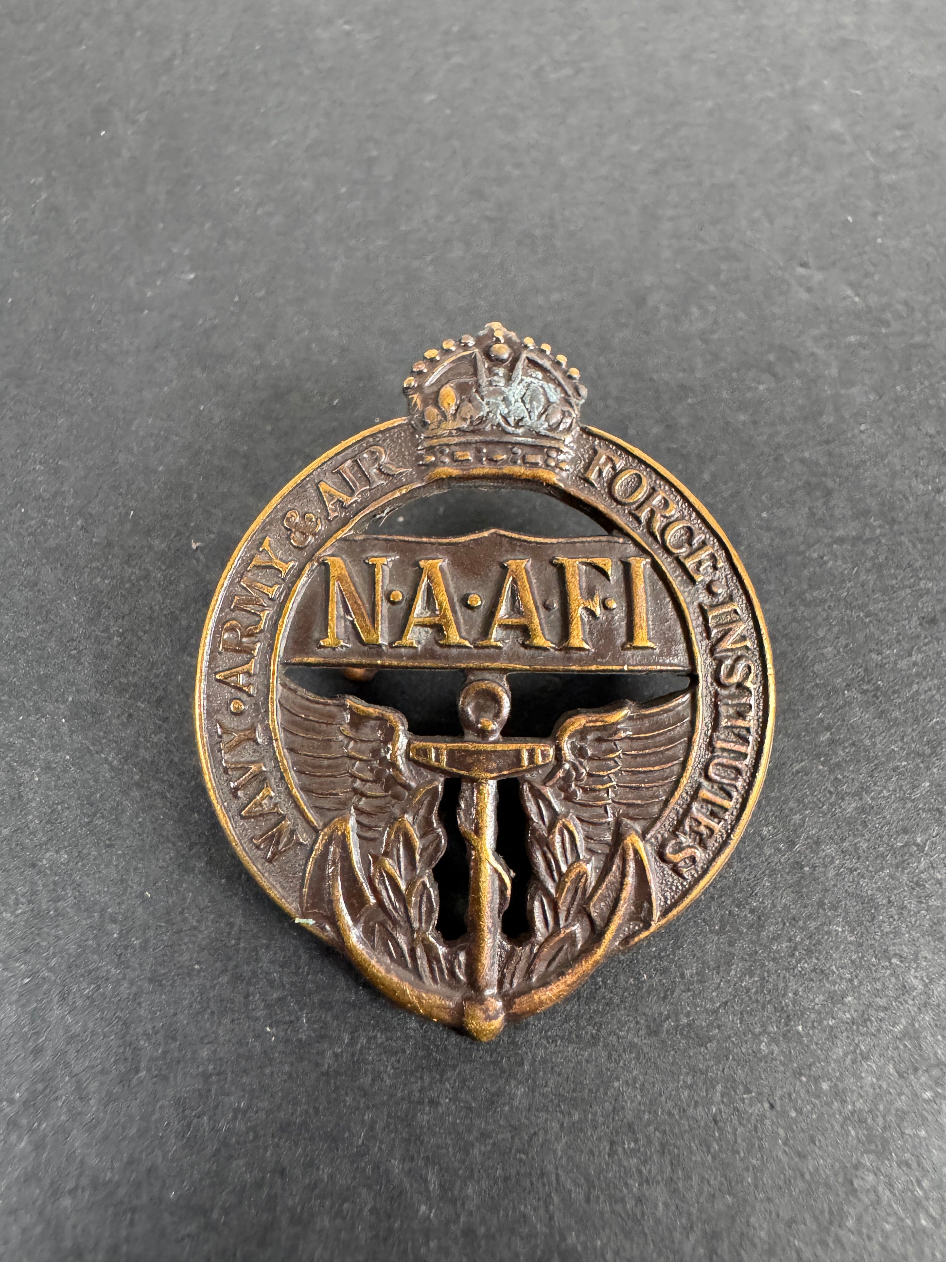 Image of WW2 British Navy Army Air Force Institute (NAAFI) Cap Badge
