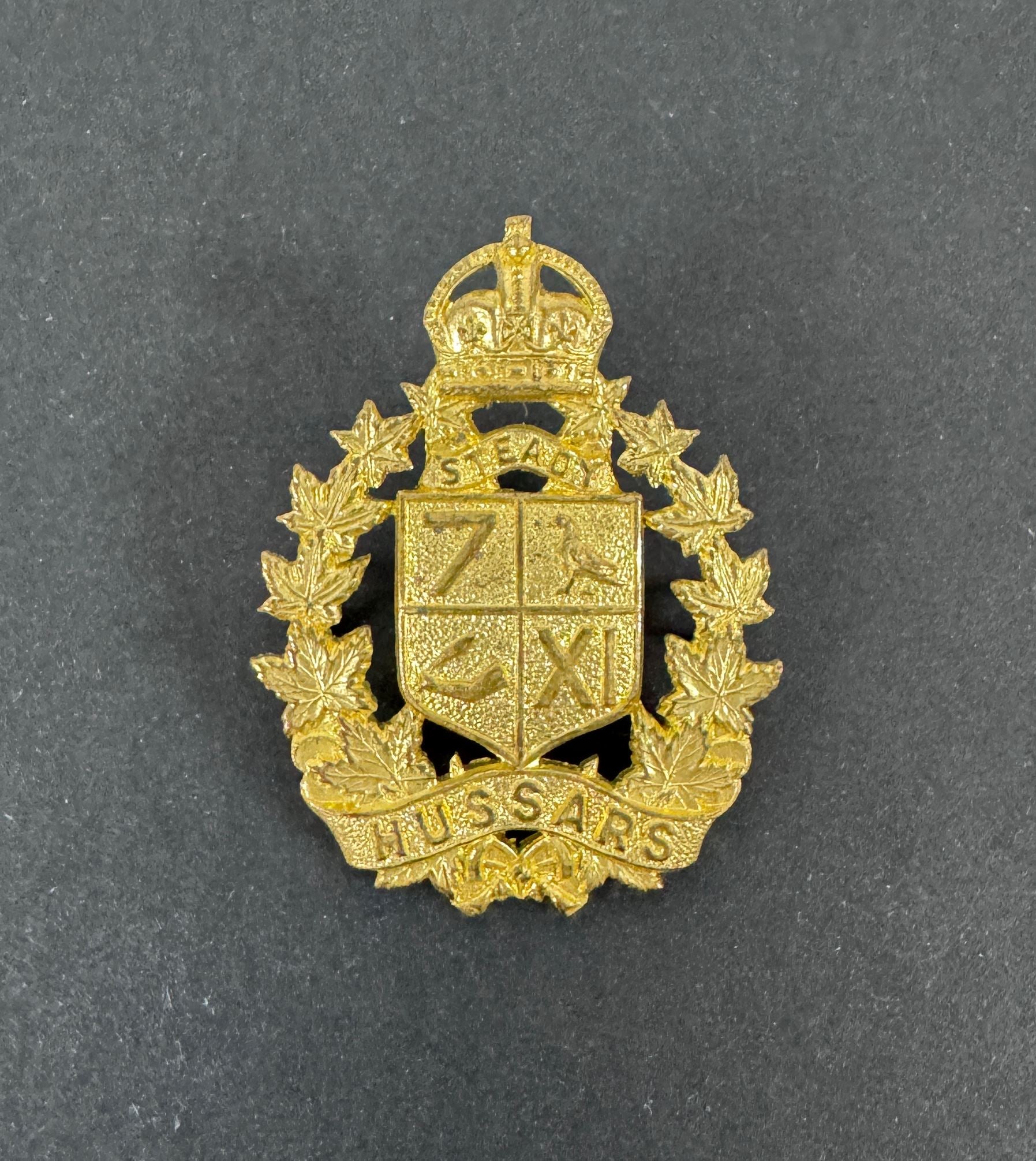 WW2 Canadian Army 7th/11th Hussars Officer's Gilt Cap Badge – An original and very scarce officer's cap badge of the 7th /...