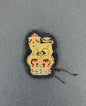 Embroidered patch of a lion and crown on a gray background. brigadier rank of British army.