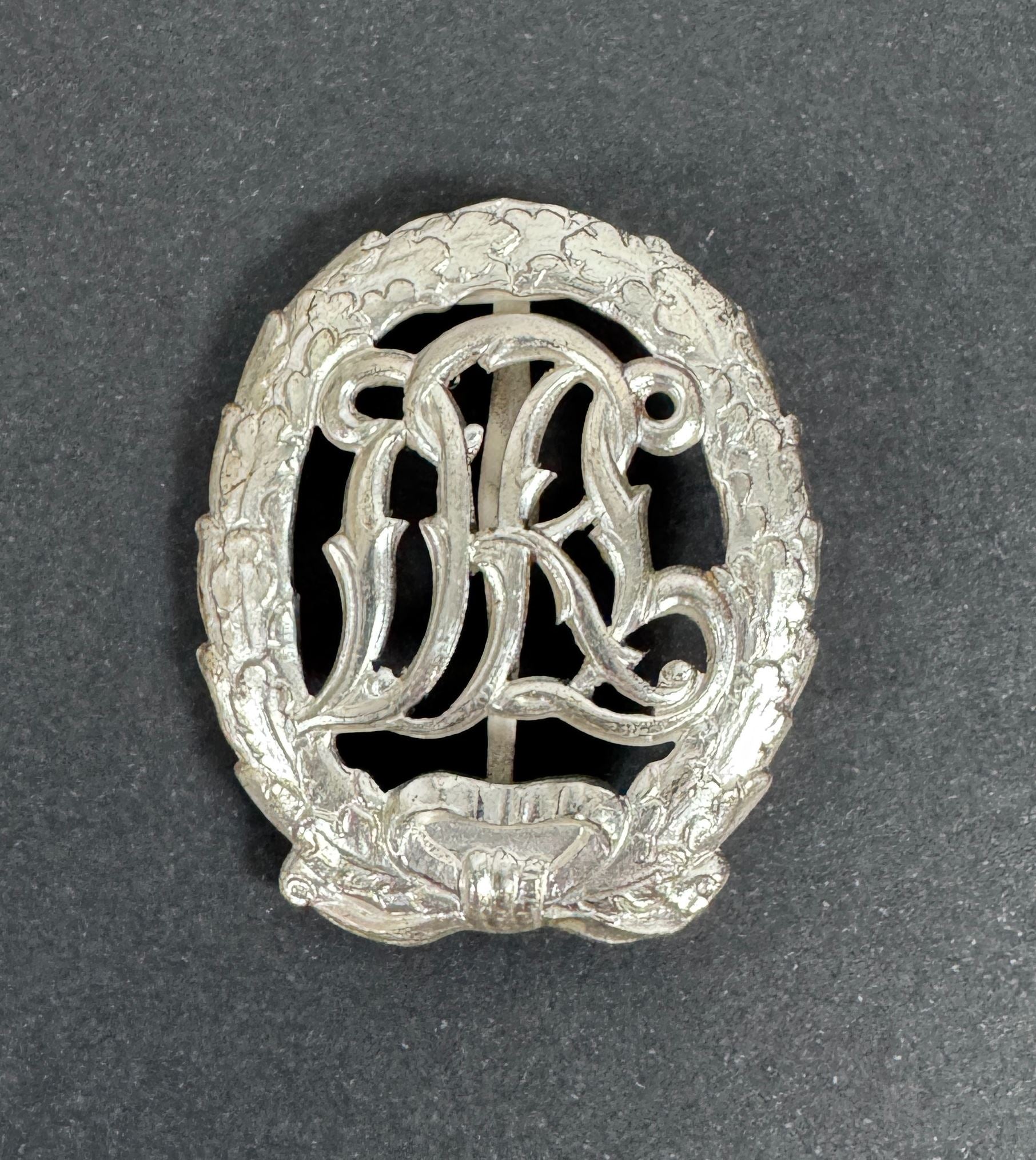 WW2 German DRL Sports Badge Silver Grade 1957 Version – An original DRL Sports Badge, silver grade. 1957 official state re...