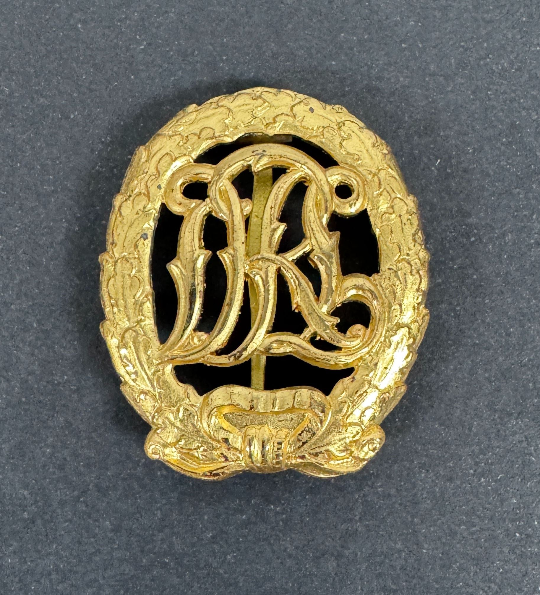 WW2 German DRL Sports Badge Gold Grade 1957 Version – An original DRL Sports Badge, gold grade. 1957 official state reissu...