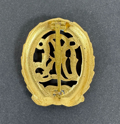 WW2 German DRL Sports Badge Gold Grade 1957 Version – An original DRL Sports Badge, gold grade. 1957 official state reissu...