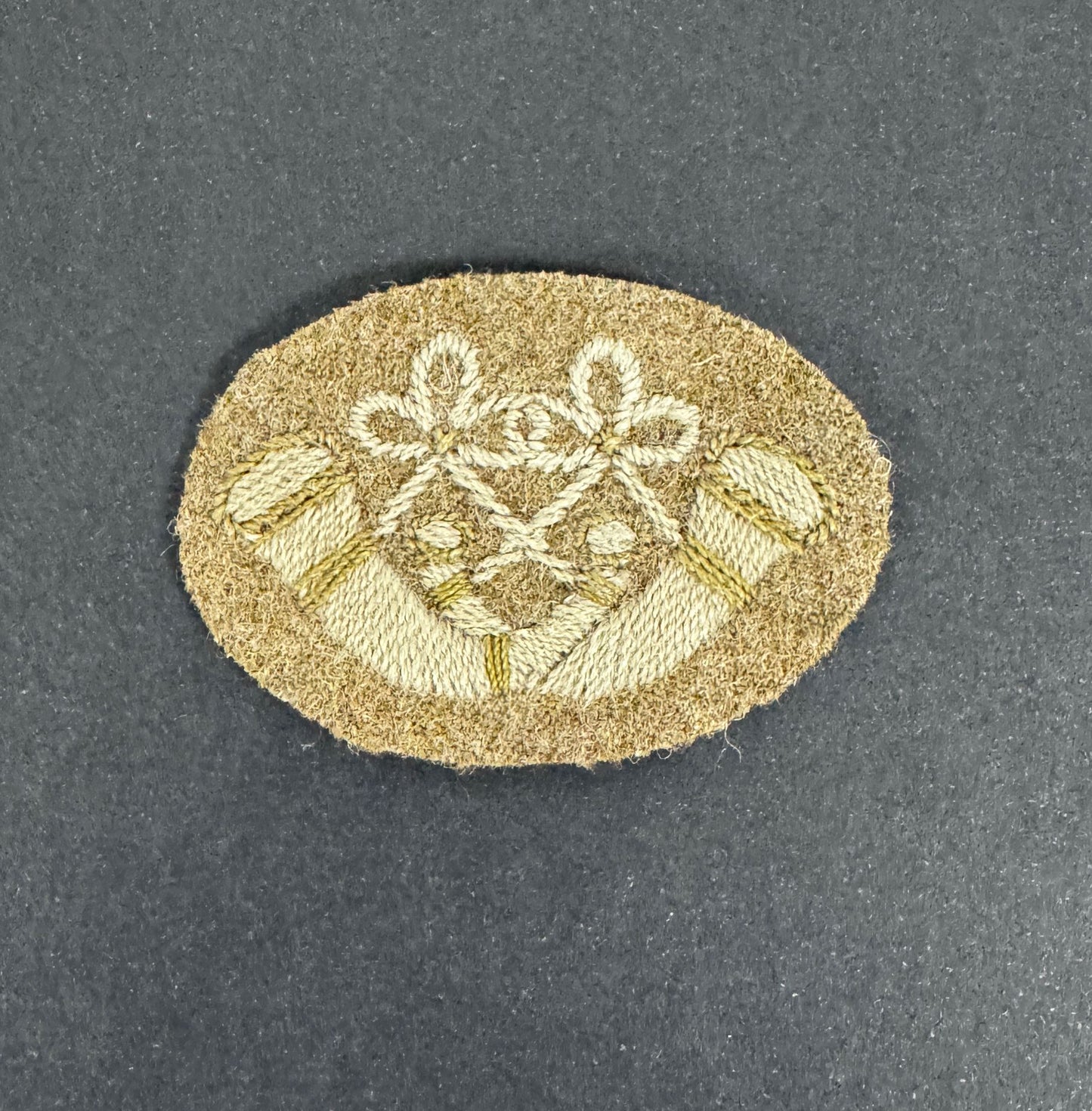 WW1 British Army Bugles Crossed Cloth Proficiency Arm Badge – An original and scarce trade proficiency cloth arm badge of...