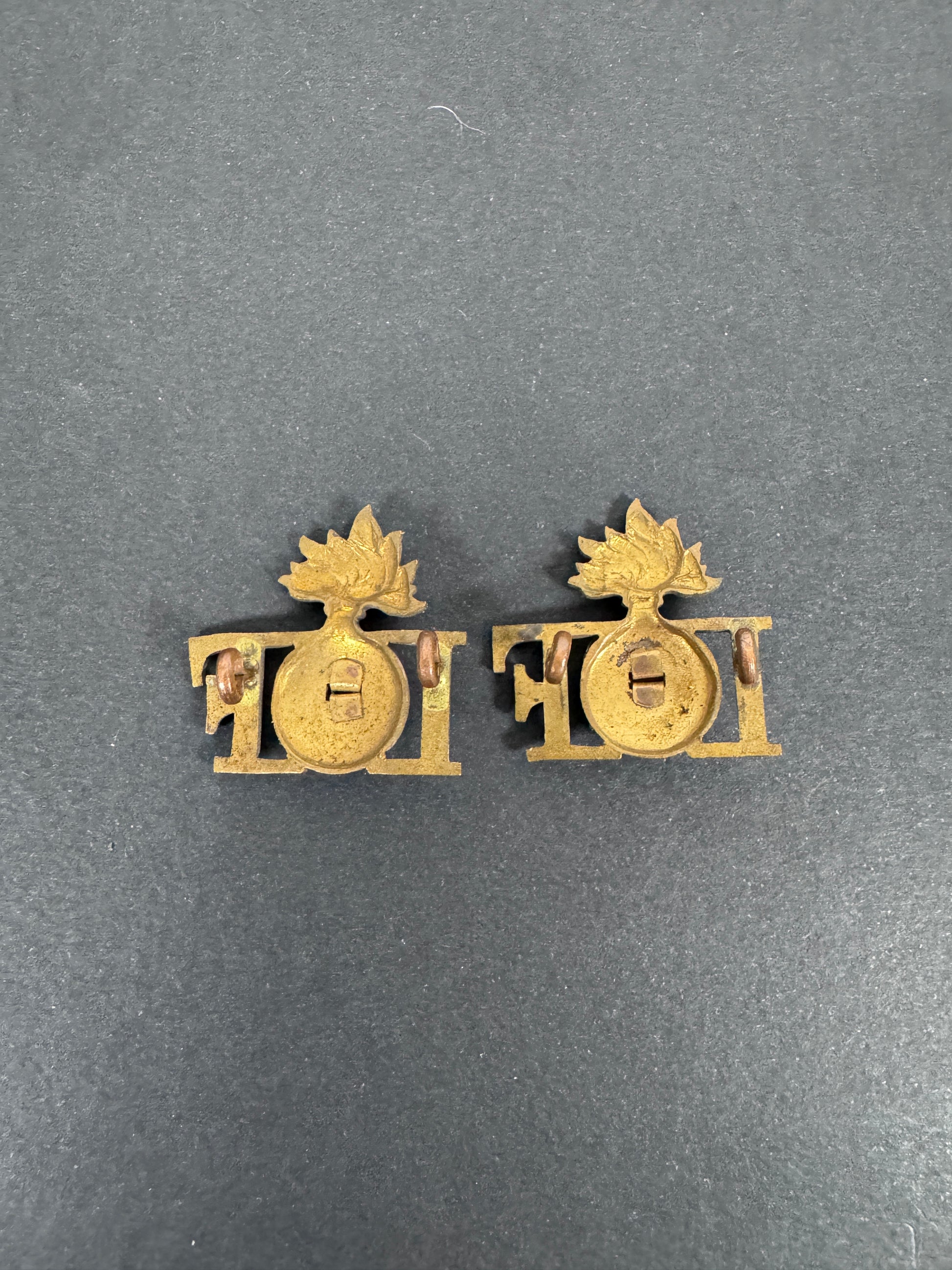 WW2 British Army Irish Fusiliers Shoulder Title Badges (Pair) – A matching pair of original uniform shoulder titles of the...