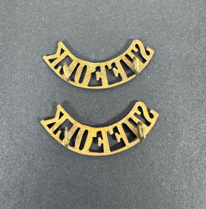 British Army Suffolk Regiment Shoulder Title Badges (Pair) – A matching pair of original uniform shoulder titles of the Su...