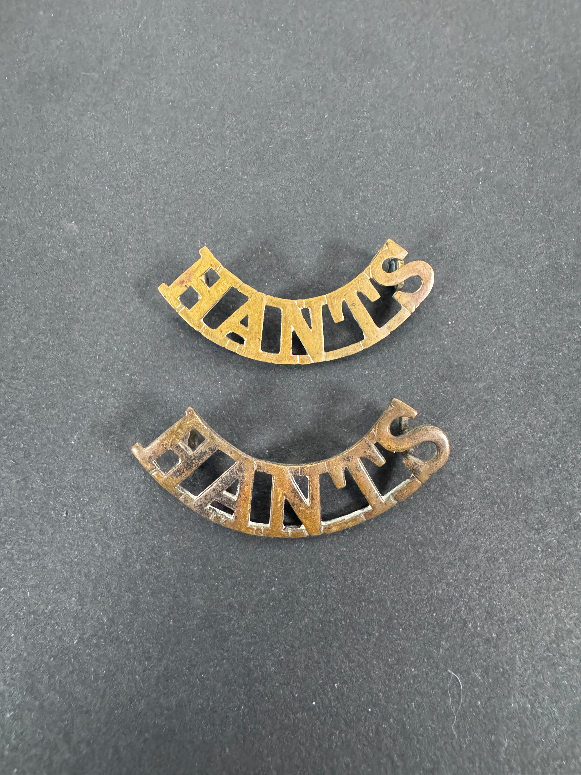 British Army Hampshire Regiment (HANTS) Shoulder Title Badges (Pair) – A matching pair of original uniform shoulder titles...