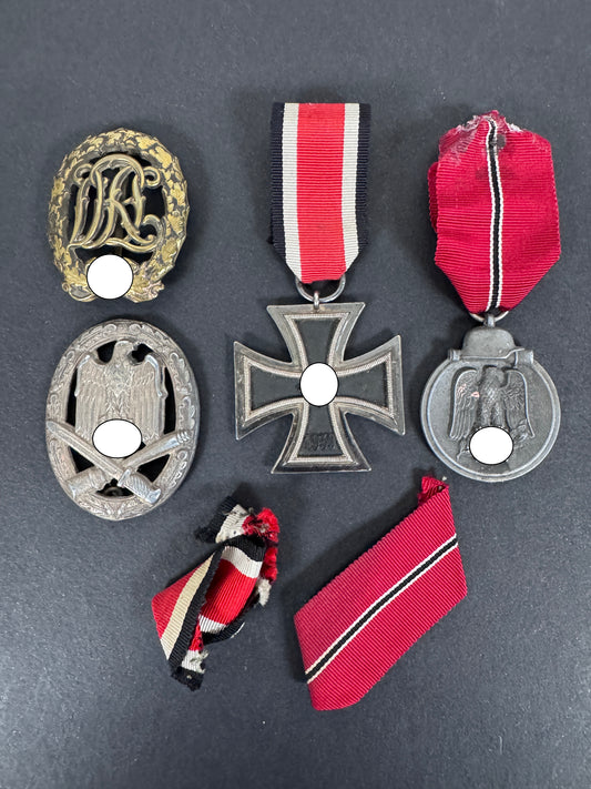 A collection of german awards of a combat assault trooper. political symbol blanked.