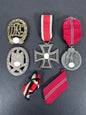 A collection of german awards of a combat assault trooper. political symbol blanked.