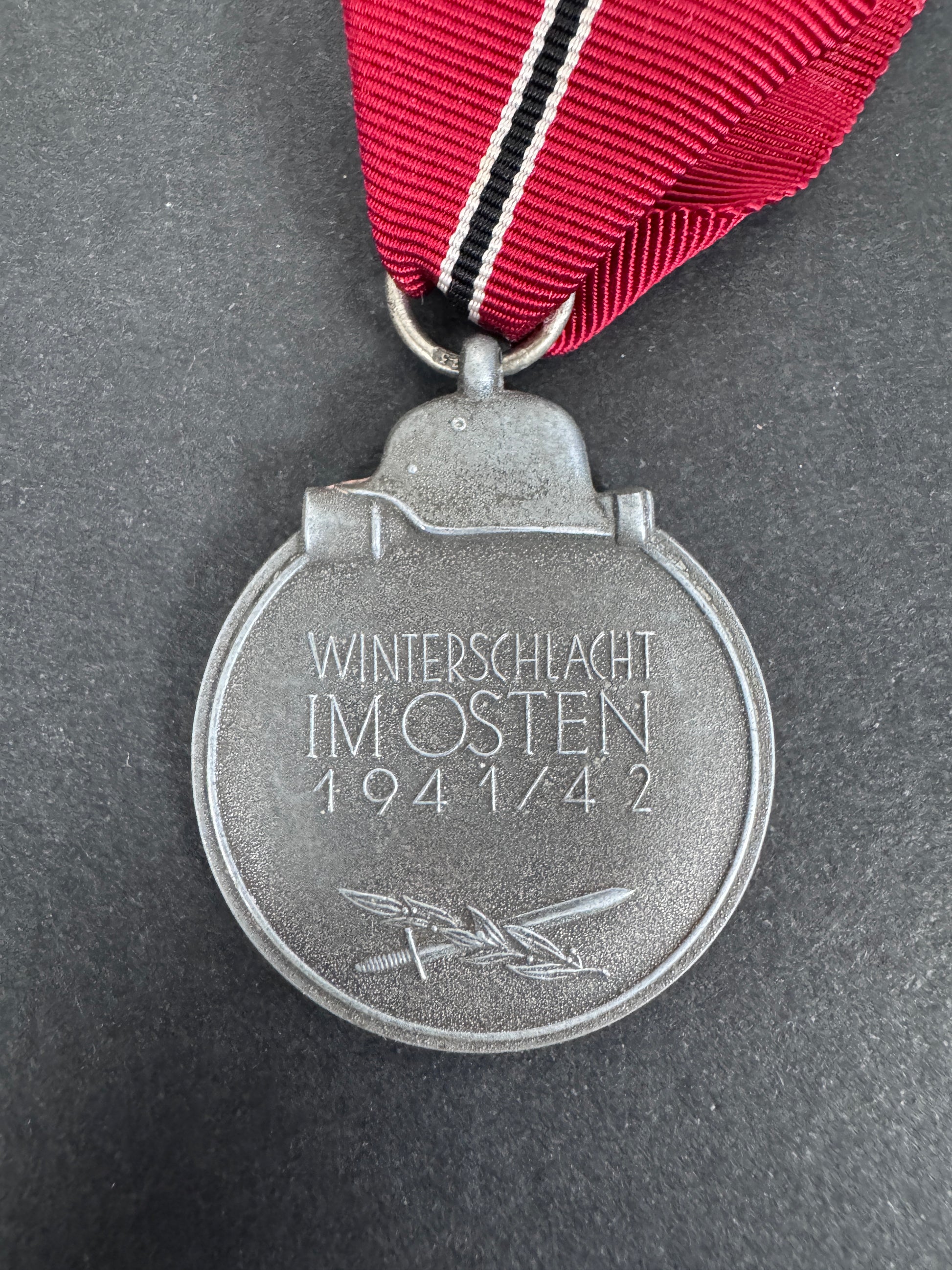 eastern front medal rear. zinc. winterschlacht im osten 1941/42 inscription, ribbon.