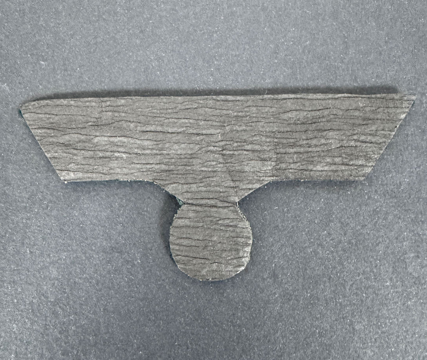 reverse side of the german army officer's tunic eagle. paper backing.