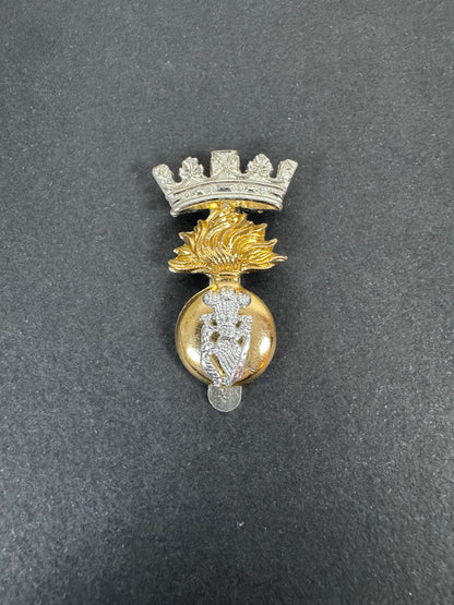 British Army Royal Irish Fusiliers Anodised Staybrite Cap Badge RA HUGHES – An original and scarce other ranks cap badge o...