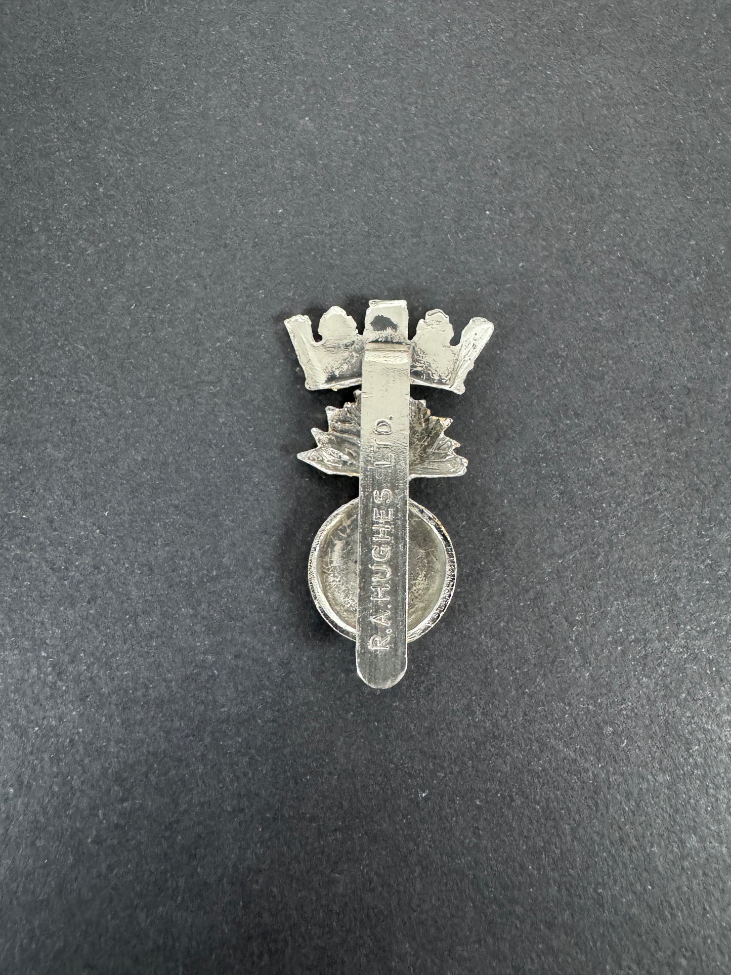 British Army Royal Irish Fusiliers Anodised Staybrite Cap Badge RA HUGHES – An original and scarce other ranks cap badge o...