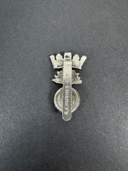 British Army Royal Irish Fusiliers Anodised Staybrite Cap Badge RA HUGHES – An original and scarce other ranks cap badge o...