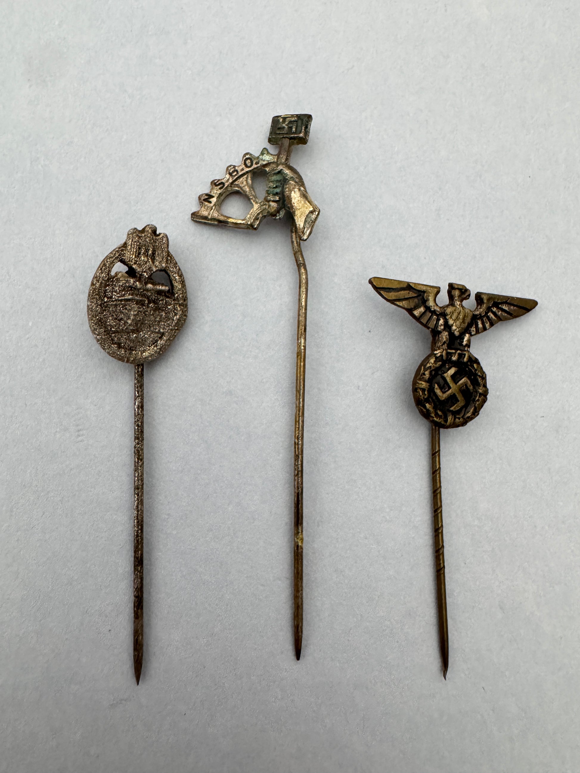 WW2 German Panzer Assault Badge & Other Stickpins – A trio of original stickpin miniature badges. A Panzer Assault Badge i...