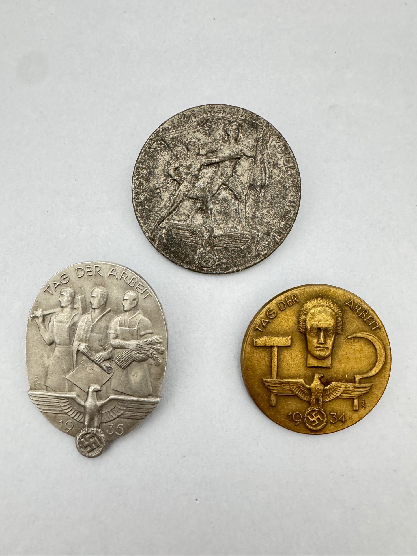 Third Reich Reichsparteitag Tinnie Badges – Three original Third Reich event 'tinnie' day badges. Tag Der Arbeit badges di...