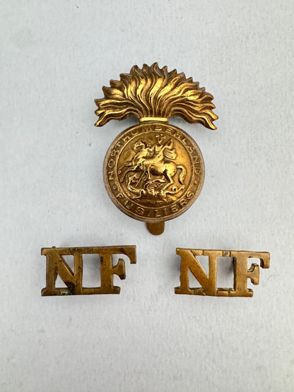 WW1 British Army Northumberland Fusiliers Cap Badge & Shoulder Titles