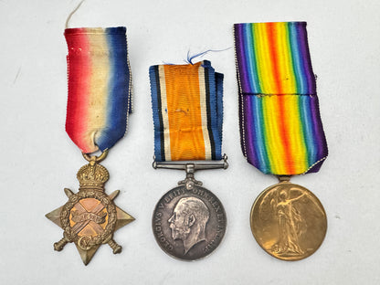 Three military medals with colorful ribbons on a white background