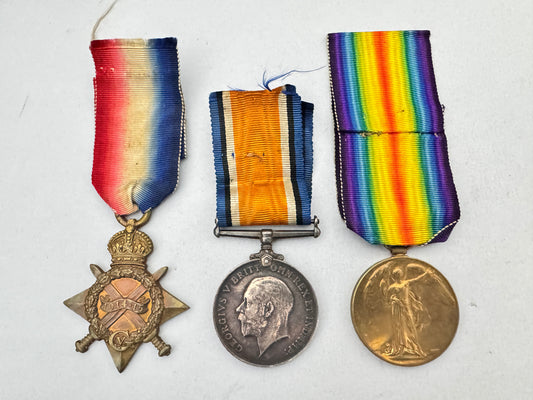 Three military medals with colorful ribbons on a white background