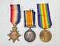 Three military medals with colorful ribbons on a white background