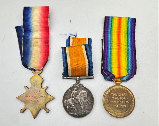 Three military medals with colorful ribbons on a white background