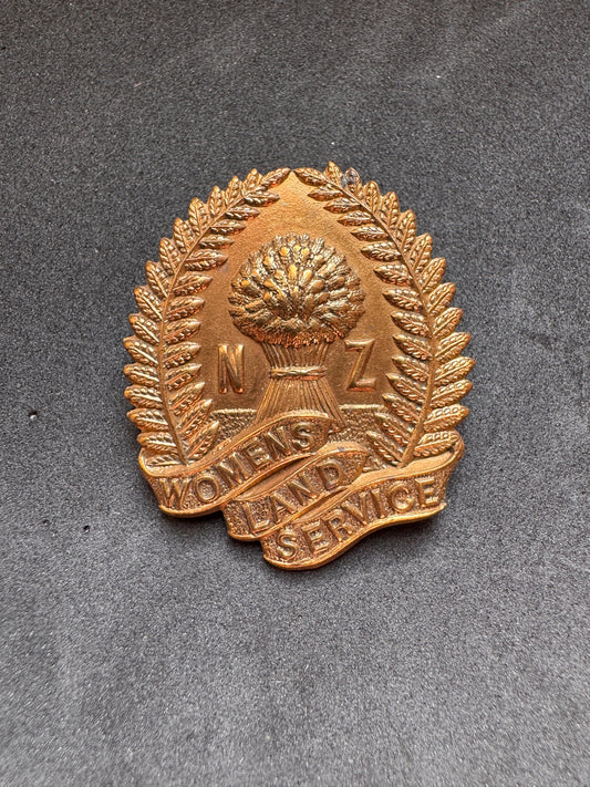 Photo 1 of WW2 New Zealand Women's Land Service Cap Badge - collectible militaria item