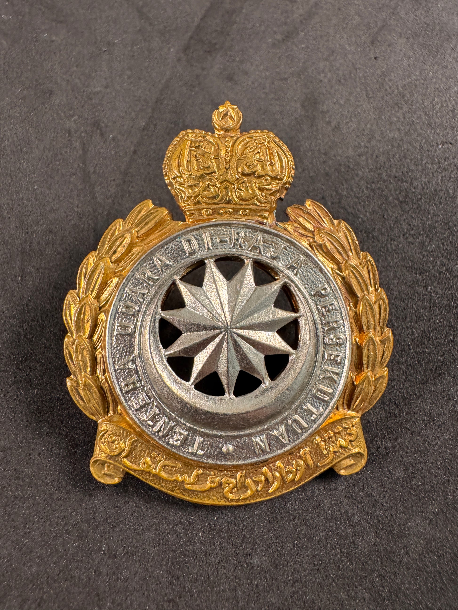 Photo 1 of Royal Malaysian Air Force Police Cap Badge - TUDM Enforcement Branch - collectible militaria item
