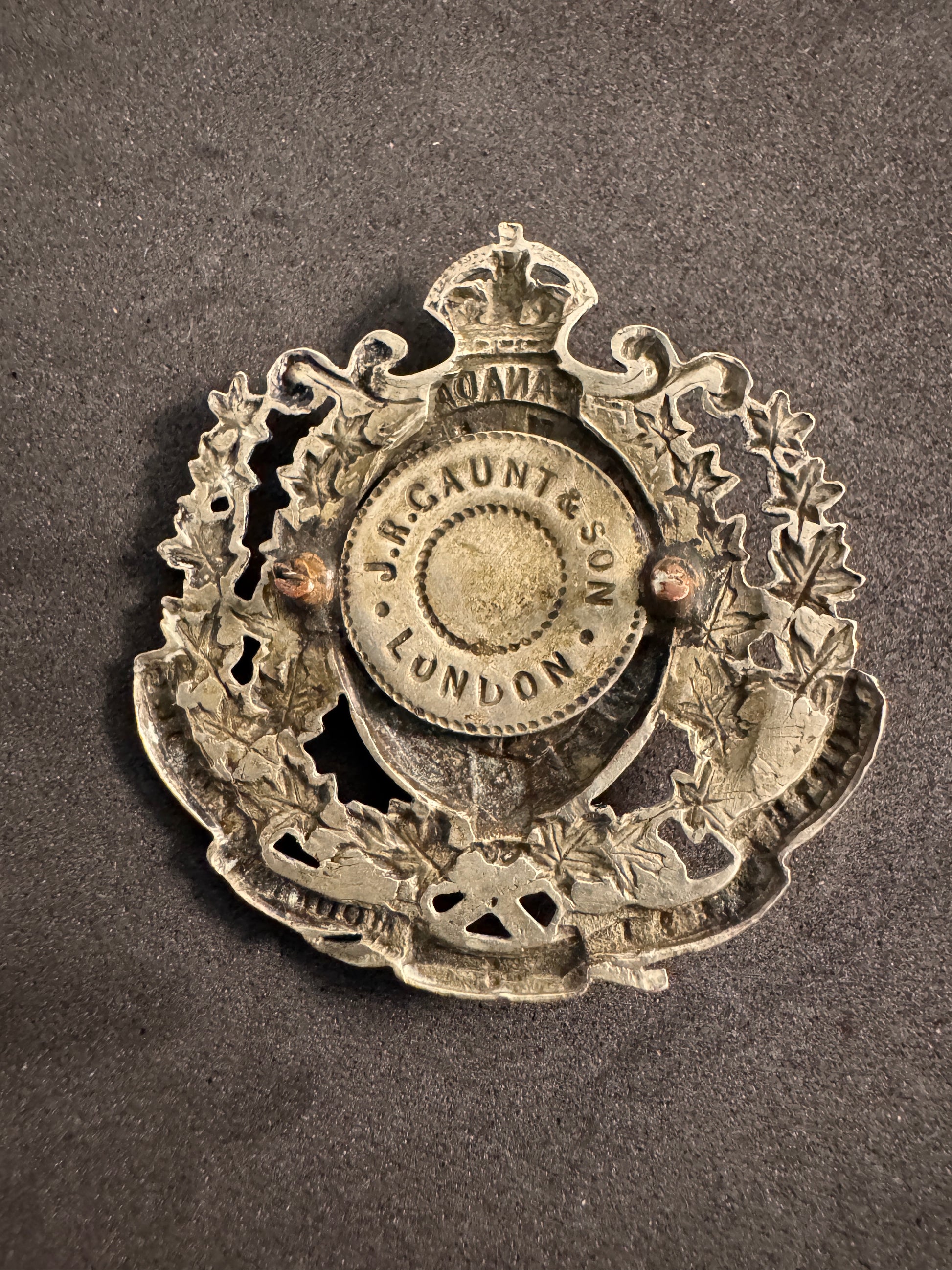 Photo 2 of Canadian North West Mounted Police Cap Badge - J.R. Gaunt London - collectible militaria item