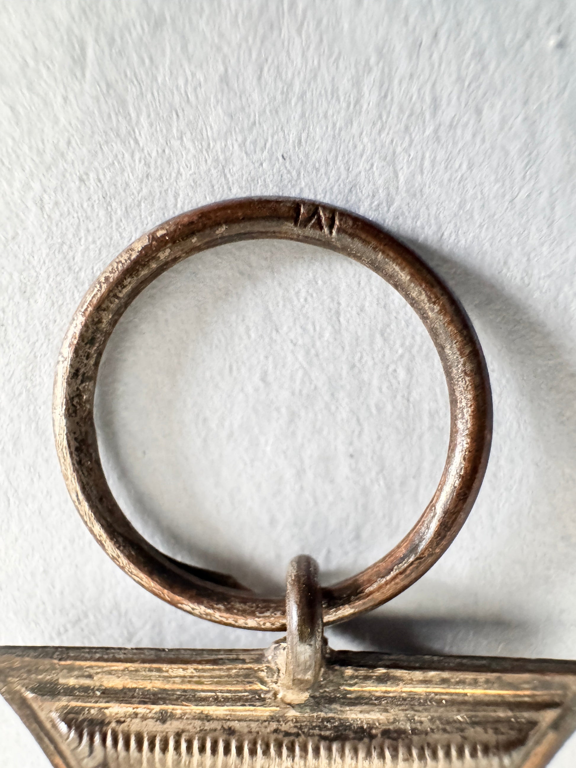 Bronze ring with a textured background
